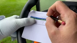 Player writing his scores